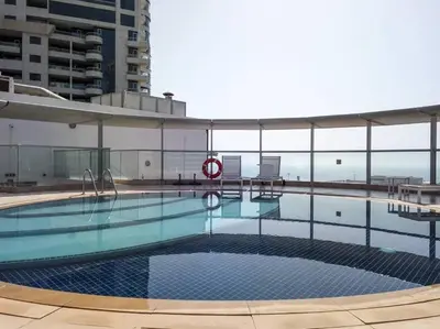 a large swimming pool on top of a building at Frank Porter - Panoramic Tower in Dubai