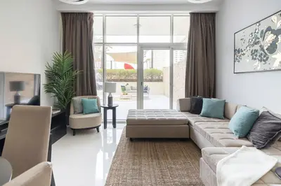 a living room with a couch and a table at Frank Porter - Tower 108 in Dubai