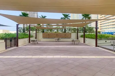 a pavilion with tables and chairs on a patio at Frank Porter - Tower 108 in Dubai