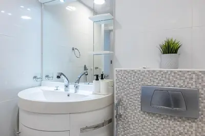 a bathroom with a sink and a mirror at 1BDR Apartment I Close To Metro I Marina Diamond 4 in Dubai