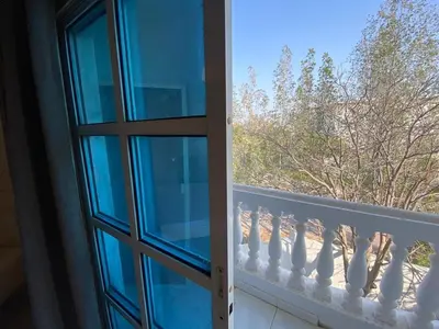 a view from a window of a balcony at Relaxing Private Rooms in Compound Housing near Burj Alarab Villa 124 in Dubai
