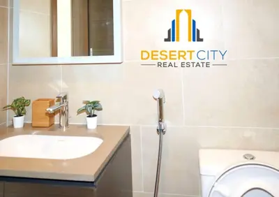 a bathroom with a sink and a toilet at Fully Furnished 1 Bed in Sobha Creek Vista hosted by Desert City Stays in Dubai