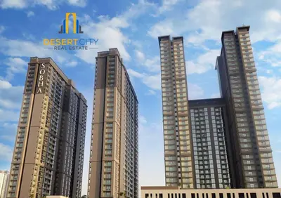 three tall buildings with the sign for the desert city real estate at Fully Furnished 1 Bed in Sobha Creek Vista hosted by Desert City Stays in Dubai