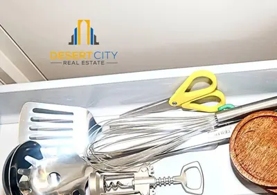 a kitchen utensils and a pair of scissors in a drawer at Fully Furnished 1 Bed in Sobha Creek Vista hosted by Desert City Stays in Dubai