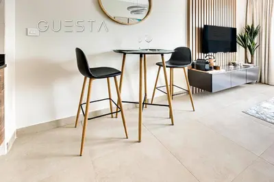 a dining room with a table and two chairs at Sparkle Tower - Studio, Dubai Marina in Dubai