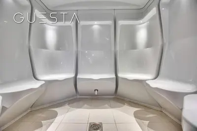 a small bathroom with white walls and white floors at Sparkle Tower - Studio, Dubai Marina in Dubai