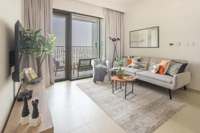 a living room with a couch and a table at Frank Porter - Downtown Views 2 in Dubai