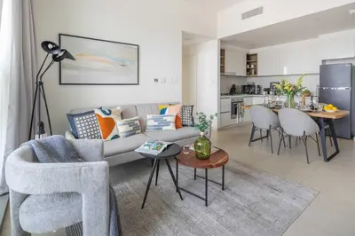 a living room with a couch and a table at Frank Porter - Downtown Views 2 in Dubai