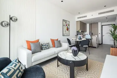 a living room with a couch and a table at Frank Porter - 15 Northside Tower 2 in Dubai