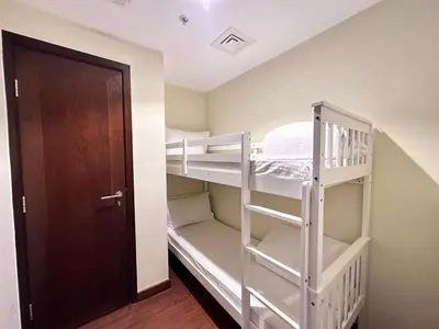 a room with two bunk beds and a door at Durrani Homes - Alluring 5BR Penthouse with Burj Khalifa and Fountain View in Dubai
