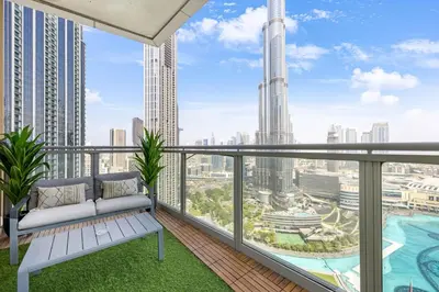 a balcony with a bench and a view of the city at Durrani Homes - Alluring 5BR Penthouse with Burj Khalifa and Fountain View in Dubai