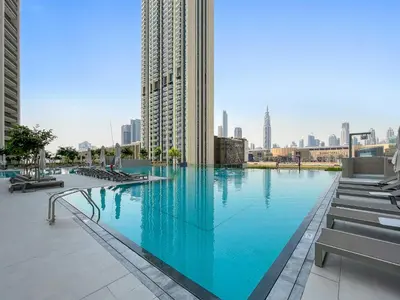 a large swimming pool in the middle of a city at Silkhaus luxurious 1BDR in new tower with pool & gym in Dubai
