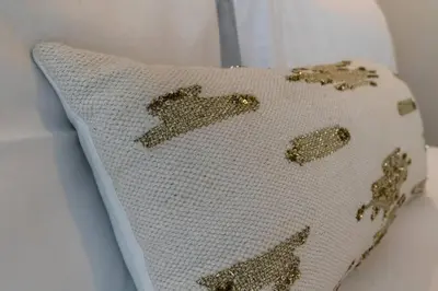 a white pillow with gold stars on it at 10min from Burj Khalifa - Sobha Creek Vistas Réservé in Dubai