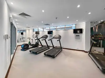 a gym with treadmills and cardio equipment in a room at 3-5 mins walk to JBR 5-7 mins to the tram in Dubai