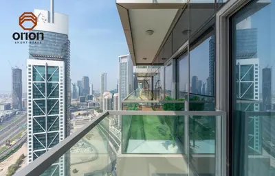 a view of the city from the top of a skyscraper at Paramount 2 Bed Apt, Roof Top Bar and Pool overlooking Burj, Triple Balcony, Fully Equipped, Free Toiletries, Full Kitchen, 2 and half Bathrooms, Ground Floor Supermarket, Influencers Haven, Sunrise and Sunset Views over the Sea From All Balcony in Dubai