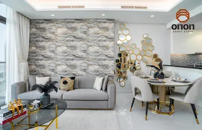 a living room with a couch and a table at Paramount 2 Bed Apt, Roof Top Bar and Pool overlooking Burj, Triple Balcony, Fully Equipped, Free Toiletries, Full Kitchen, 2 and half Bathrooms, Ground Floor Supermarket, Influencers Haven, Sunrise and Sunset Views over the Sea From All Balcony in Dubai