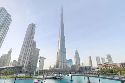 a view of a city with tall buildings at Manzil - Luxury 3BR Villa w/ maid room, Full Burj & Fountain view in Dubai