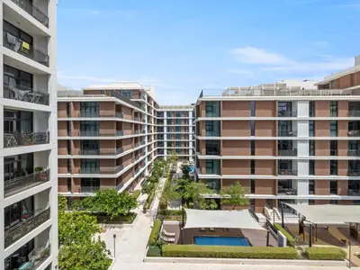 an aerial view of two apartment buildings at Fantastic 1 BR in Park Point - Dubai Hills in Dubai