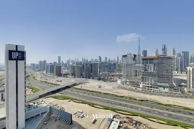 a view of a city with buildings and a highway at Manzil - Ultra Luxury 1BR apartment Paramount Tower with Burj Khalifa and Downtown Views in Dubai