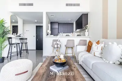 a living room with a couch and a table at Elegant 3BR in a Prime Location Near Metro, Business Bay in Dubai