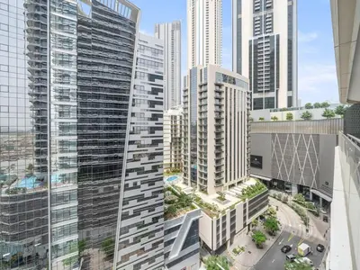 an aerial view of a city with tall buildings at Elegant Apartment Amidst Vibrant Area With Balcony in Dubai