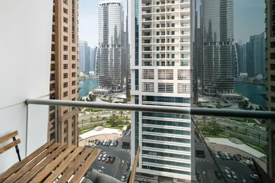 a view of a city from the balcony of a building at Cozy JLT Studio Lakeview Pool Metro Access in Dubai