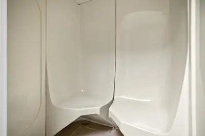 a bathroom with a white toilet in a stall at Cozy JLT Studio Lakeview Pool Metro Access in Dubai