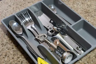 a tray filled with utensils sitting on a counter at Furnished studio in Arch Tower, JLT near metro in Dubai