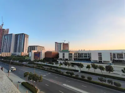 a view of a city with tall buildings and a street at New 1 bedroom in Sobha Hartland in Dubai