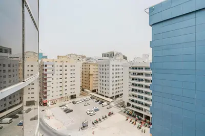 an overhead view of a parking lot in a city at RH- Spacious, Stylish, 01BR near Mall of Emirates in Dubai