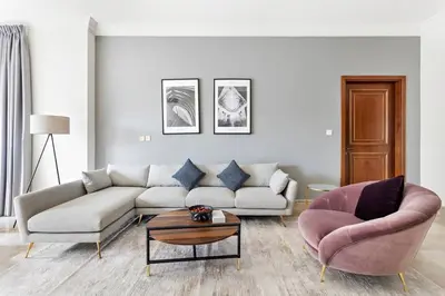 a living room with a couch and two chairs at StoneTree - Fairmont South 2 BR - Near Beach in Dubai