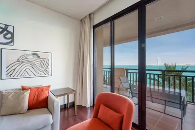 a living room with a view of the ocean at GuestReady - A Glimpse of Burj Al Arab in Dubai