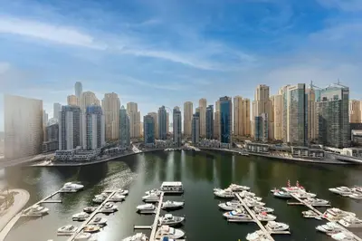 a group of boats docked in a harbor in a city at BRAND-NEW 1 Bedroom with full Marina View in Dubai