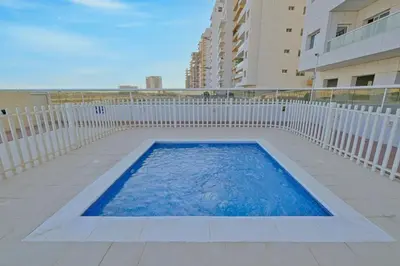 a swimming pool in the middle of a building at Mira Holiday Homes - Beautiful Studio in Living Legends in Dubai
