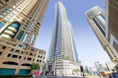 a tall building in the middle of two tall buildings at Ocean Heights - Gorgeous One Bedroom in Dubai