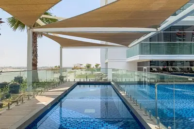a swimming pool on the roof of a building at Frank Porter - Carson A in Dubai