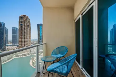 a balcony with chairs and a view of the city at Luxury studio at JLT near metro in Dubai