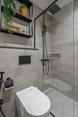 a bathroom with a toilet and a glass shower at Upscale studio at JLT near metro in Dubai