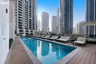 a swimming pool on the roof of a building at bnbme - Luxury 1BR Apt w Burj Khalifa Views Pool Gym & Prime Location Near Dubai Mall in Dubai