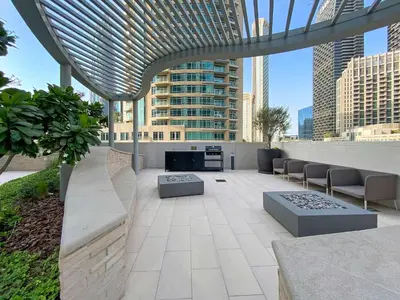a rooftop patio with a view of a city at Silkhaus Opera district in Downtown new tower with pool & gym in Dubai