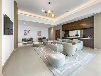 a living room with a couch and a table at Silkhaus Opera district in Downtown new tower with pool & gym in Dubai