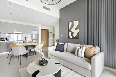 a living room with a couch and a table at Silkhaus Opera district in Downtown new tower with pool & gym in Dubai