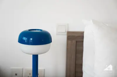 a blue and white object on a pole in a room at Stunning Palm Views Apt on the beach Dubai in Dubai