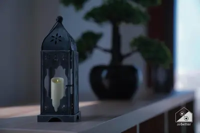 a candle holder sitting on a table with a plant at Stunning Palm Views Apt on the beach Dubai in Dubai