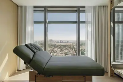 a hospital bed in a room with a large window at SIRO One Za'abeel in Dubai