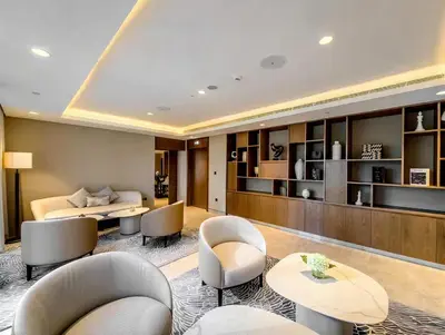 a living room with chairs and a bed and a table at Vogue Downtown Act Two near Burj Khalifa and Dubai Mall, Three Bedroom Plus Kids room Apartment with Balcony and Burj Khalifa View, Access to all Amenities in Dubai