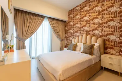 a bedroom with a large bed with a brick wall at INA Homes - Act 1 Full Burj Khalifa and Fountain Views in Dubai