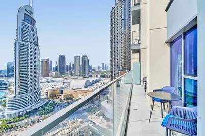 a balcony with a view of a city at FIRST CLASS 2BD, Full Burj Khalifa view in the Heart of Downtown in Dubai