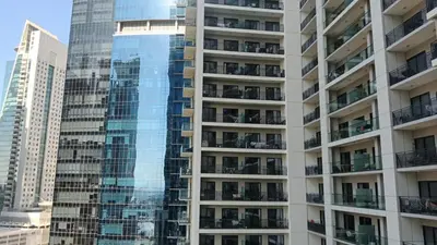 a tall building with balconies in a city at Quasi-Hotels Zada Cozy Lux in Business Bay 1BR in Dubai