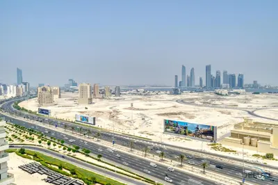 an aerial view of a city with a freeway at Pristine 1BR at Binghatti Creek Al Jadaf by Deluxe Holiday Homes in Dubai
